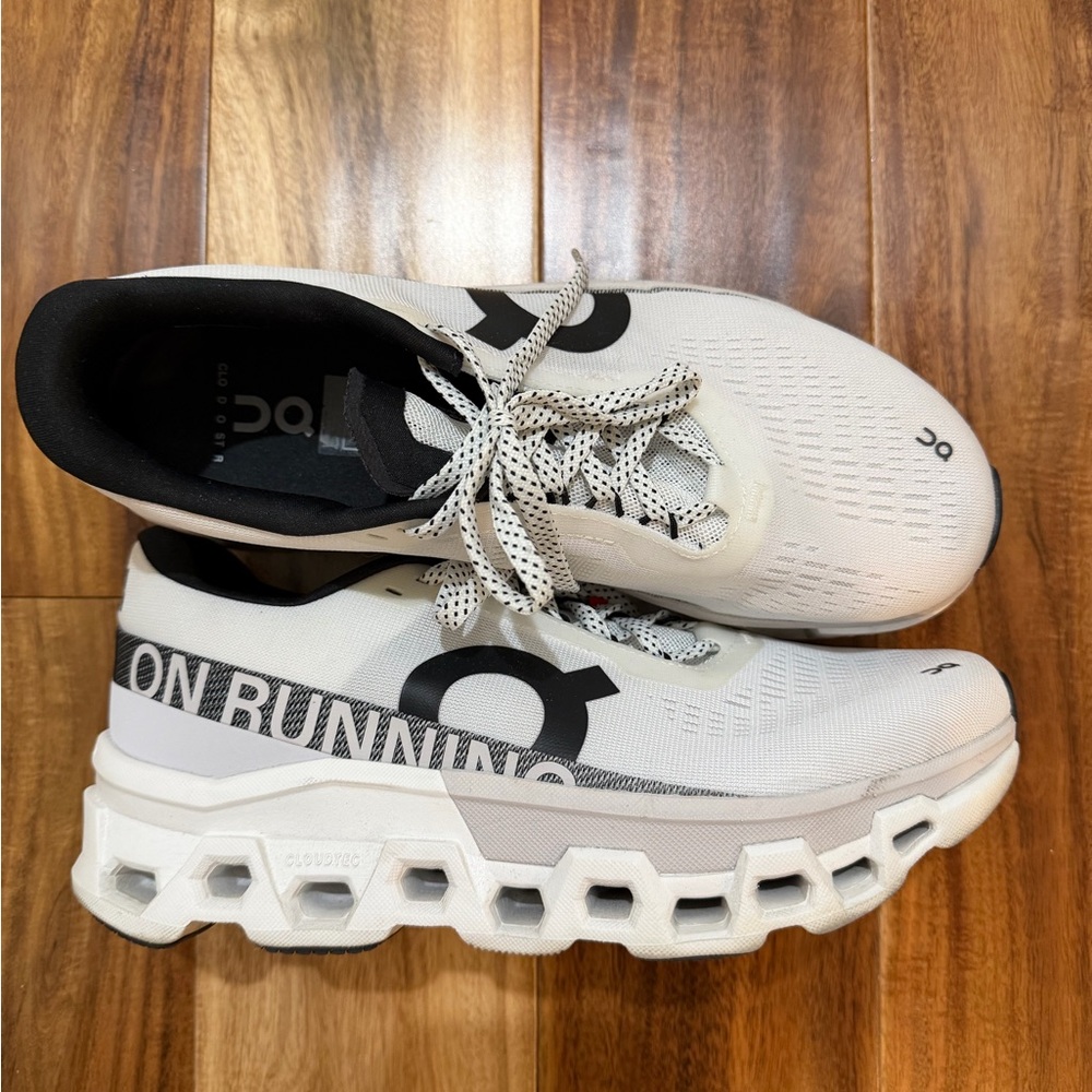 On Running White and Black Athletic Shoes